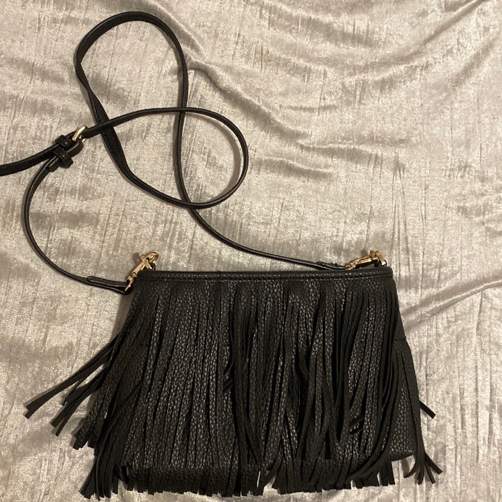 Black leather brass adjustable bag.